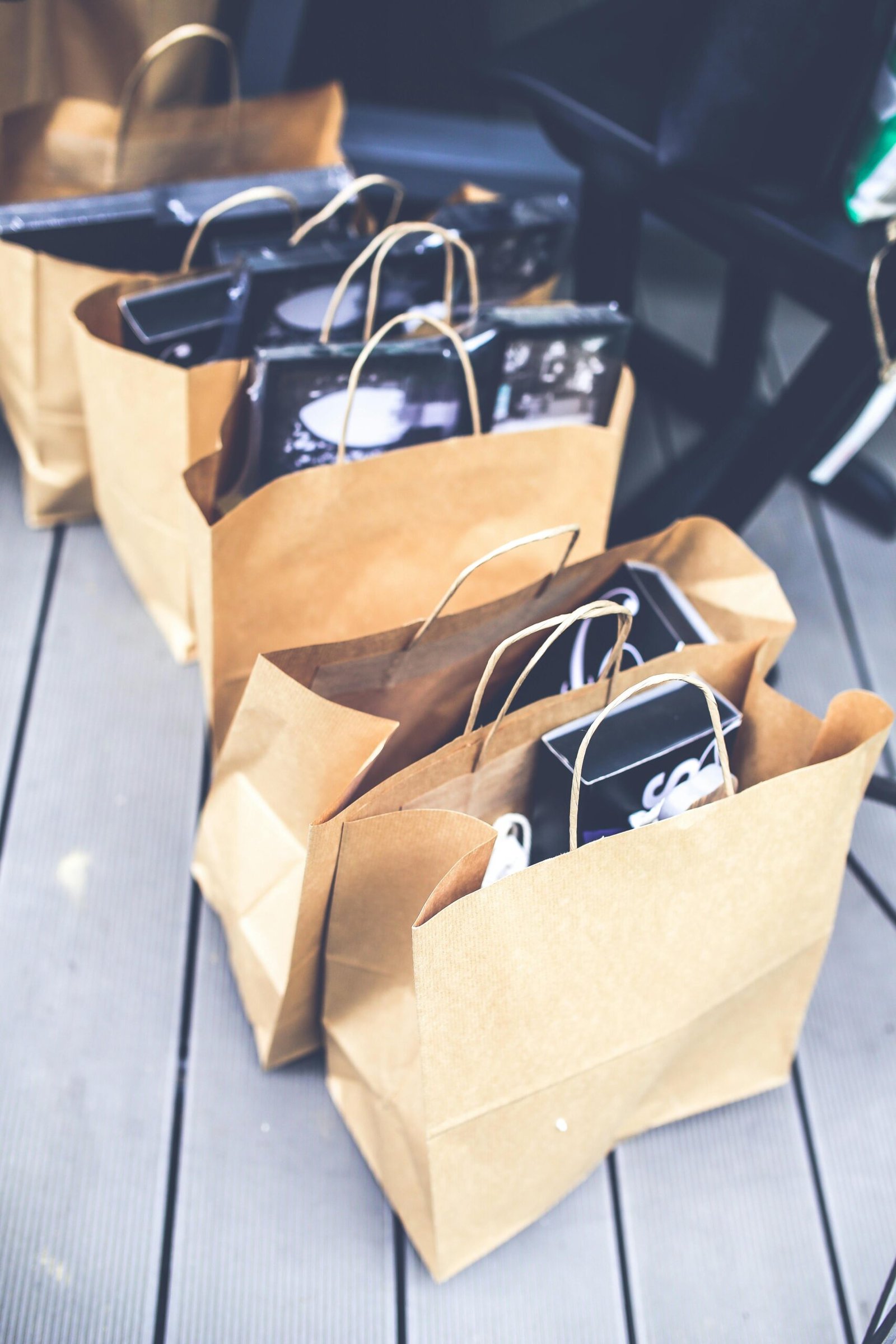 A collection of brown paper bags filled with shopping items, perfect for retail themes.